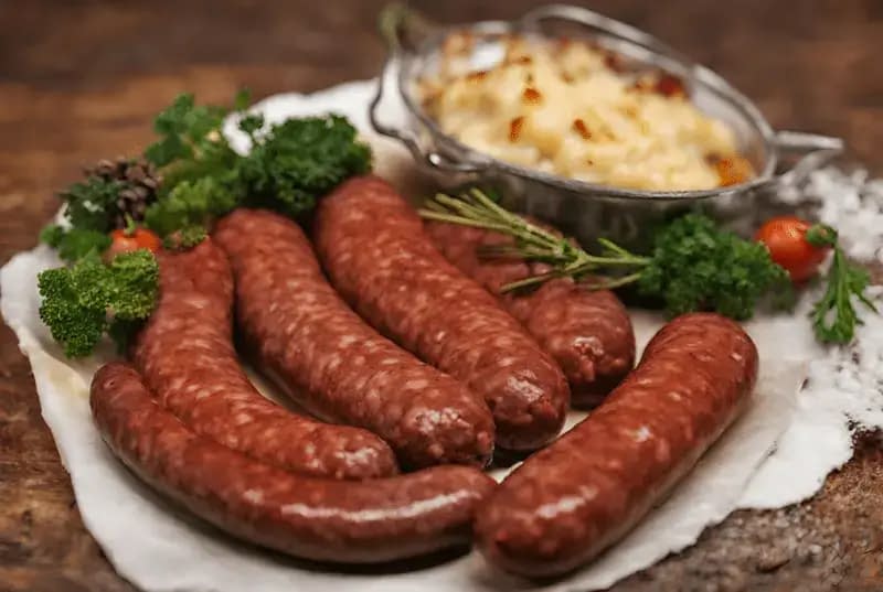 Preparing the deer sausage for baking